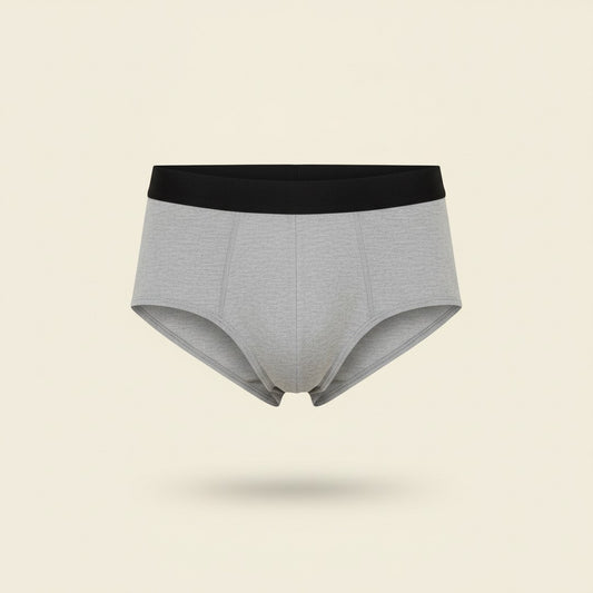 Sérényl — slip absorbant homme gris, packshot fond crème, lavable et réutilisable